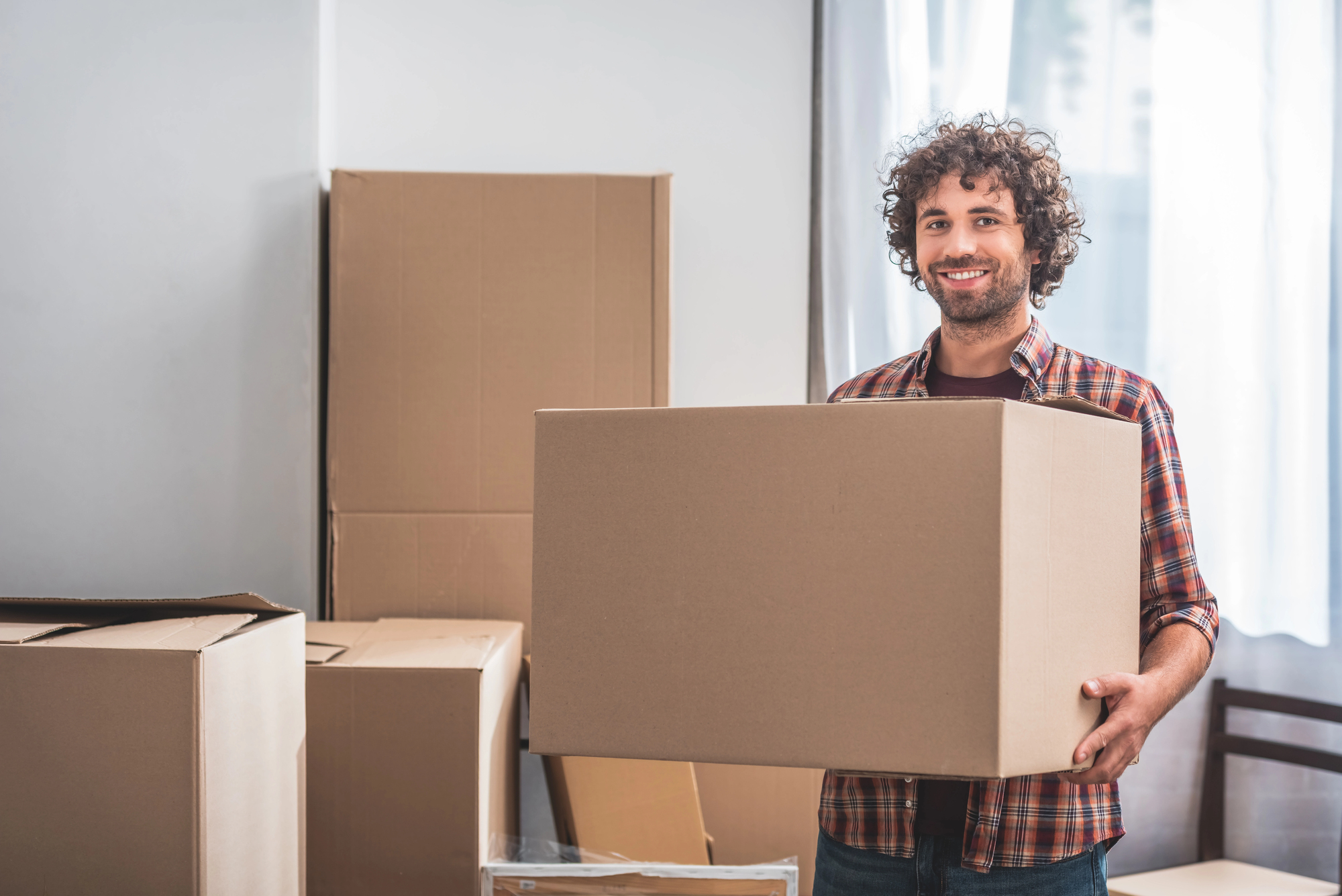 man moving boxes